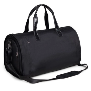 Detailed view of black waterproof garment bag featuring reinforced handles and shoulder strap