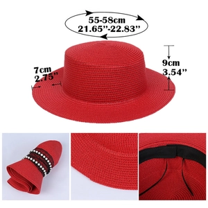 Detail view of red straw hat with pearl lace band, foldable texture and adjustable strap