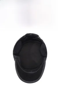 Detail view of winter hat showing warm inner lining and foldable ear protection flaps