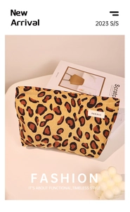 Close-up of leopard print corduroy makeup bag with H&R label on fashion magazine