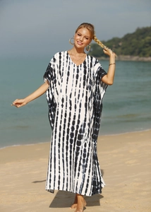 Detail of beach cover-up featuring black and white vertical tie-dye snake pattern