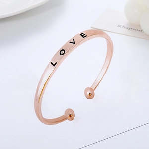 Rose gold adjustable open bangle featuring LOVE engraving and stylish bead ends