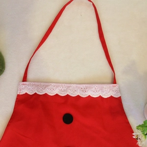 Festive red Christmas Santa apron with white lace trim and black button details