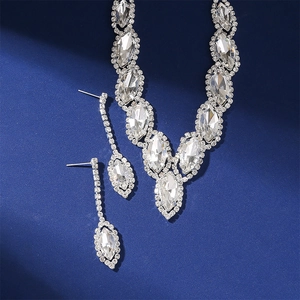 Detail of luxury bridal jewelry set with silver base and marquise cut crystal stones