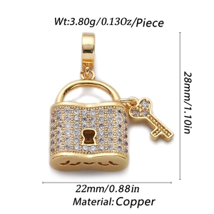 Detail of gold-plated copper lock pendant with crystal inlay and key, 28mm height