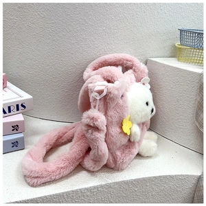Detail of pink plush kids handbag with 3D cute animal head and flower decoration