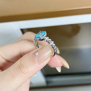 Luxurious S925 silver ring featuring a neon blue-green oval gemstone with diamond accents