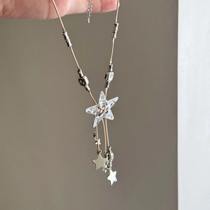 Bohemian silver star pendant necklace with fringe and beige cord for stylish layering