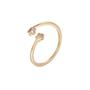 Macro shot of gold adjustable ring featuring two stars with one sparkling crystal stone