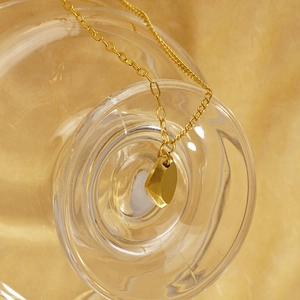 Minimalist gold heart pendant necklace with brushed matte geometric wish stone design