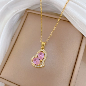 Elegant gold titanium steel necklace with pink heart pendant and pavé rhinestones