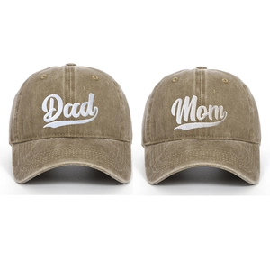 Detail of Dad and Mom embroidered washed cotton baseball caps with retro vintage texture