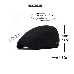 Detail of black cotton beret showing G-DYST embossed pattern and metal adjustment buckle