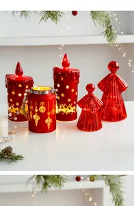 Detail of red Christmas LED candles and angel lights with snowflake and elk patterns