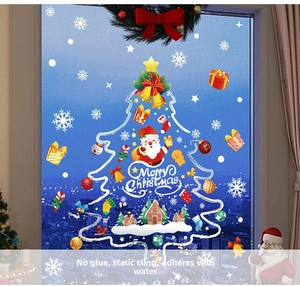 Detail of glue-free static Christmas window stickers featuring Santa and snowflake patterns