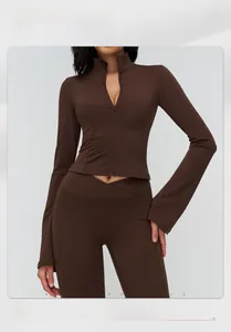 Detail view of high-stretch yoga jacket with flared sleeves and standing collar