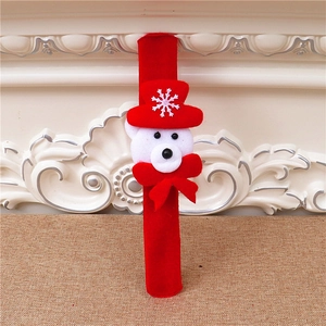 Detail of red plush Christmas snap bracelet featuring a cute polar bear with snowflake hat