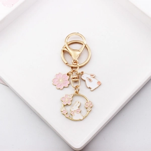 Cute Japanese sakura rabbit keychain metal bag charm pendant aesthetic gift accessory.