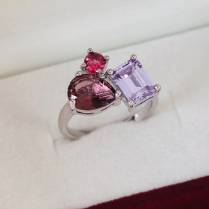 Minimalist silver ring with colorful micro-pave zircons in a white velvet gift box
