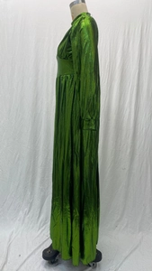 Detail of pleated avocado green maxi dress with metallic finish on mannequin