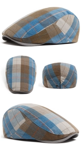 Detail view of plaid newsboy cap with metal buckle and vintage checkered pattern texture