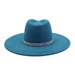 Detail of teal faux suede fedora hat featuring a sparkling rhinestone decorative band
