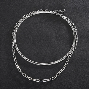 Detail of silver double layer stainless steel chain necklace with lobster clasp mechanism