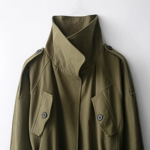 Olive green cotton trench coat with epaulettes and large pockets in high-quality canvas