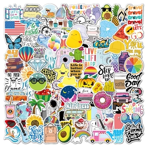 Flat lay of colorful waterproof PVC stickers with travel and positive energy slogans