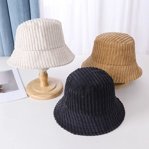 Detailed close-up of corduroy bucket hats in cream, khaki, and black colors