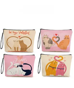 Detail view of four cute cat and heart pattern designs on fabric cosmetic bags