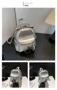 Detailed view of silver PU backpack with square metal studs and cross pendant decoration