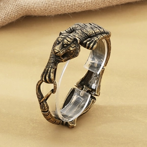 Macro detail of retro tiger head bracelet with antique bronze finish and realistic textures