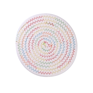 Handwoven heat resistant round cotton dining placemat with colorful geometric stitching