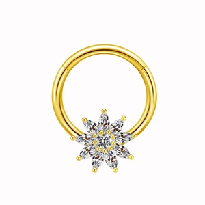 Elegant gold nipple ring featuring a sparkling crystal flower design for body piercing