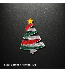 Detail showing Christmas tree brooch dimensions of 32mm by 45mm with colorful rhinestones