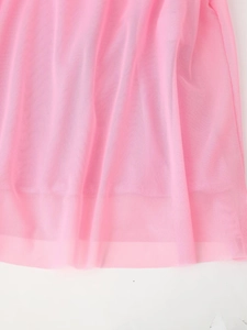 Close-up of pink breathable mesh fabric with delicate mesh texture on dress hem