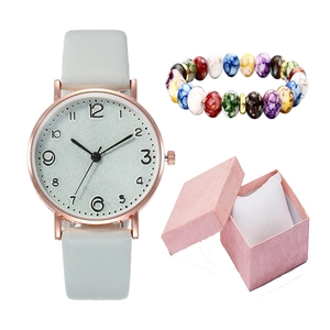 Women's quartz watch with beaded bracelet set displayed in a pink jewelry gift box