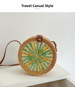 Handcrafted round rattan beach bag featuring colorful shell inlay and leather straps
