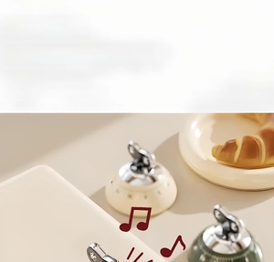 Mechanical kitchen timer with green dial in a warm baking scene with croissants