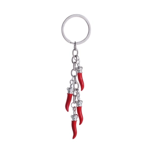Silver keychain with five red chili pendants and crown accents on white background