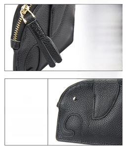 Detail of genuine leather elephant coin purse with gold zipper and fringe tassel