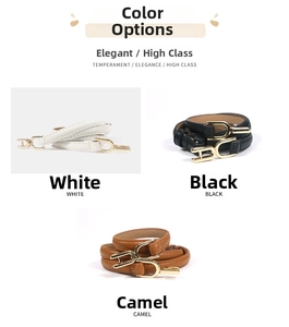 Close-up of thin leather waist belts in white, black and camel with gold metal buckles