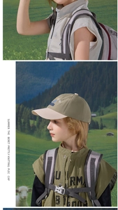 Detail of color-block kids baseball cap featuring embroidery on a mountain hiking scene