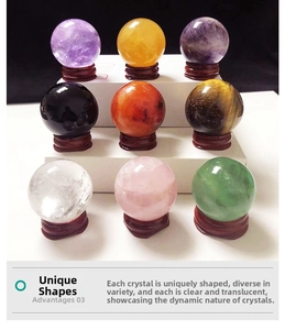 Set of 9 colorful natural crystal spheres with ornate red wooden stands on a white shelf