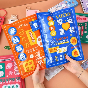 Dual-tip highlighters in lucky blind bag packaging with orange and blue designs