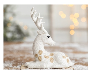 Macro shot of white Christmas reindeer decor with gold spots and sparkling texture details