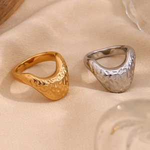 18K gold and silver plated stainless steel rings with unique hammered texture on fabric