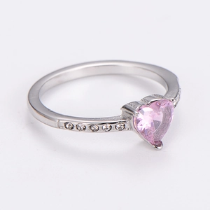 Detail shot of heart-shaped pink zircon ring with polished stainless steel band