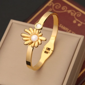 Polished gold flower hinge bangle with sunflower design, white pearl and zircon accent